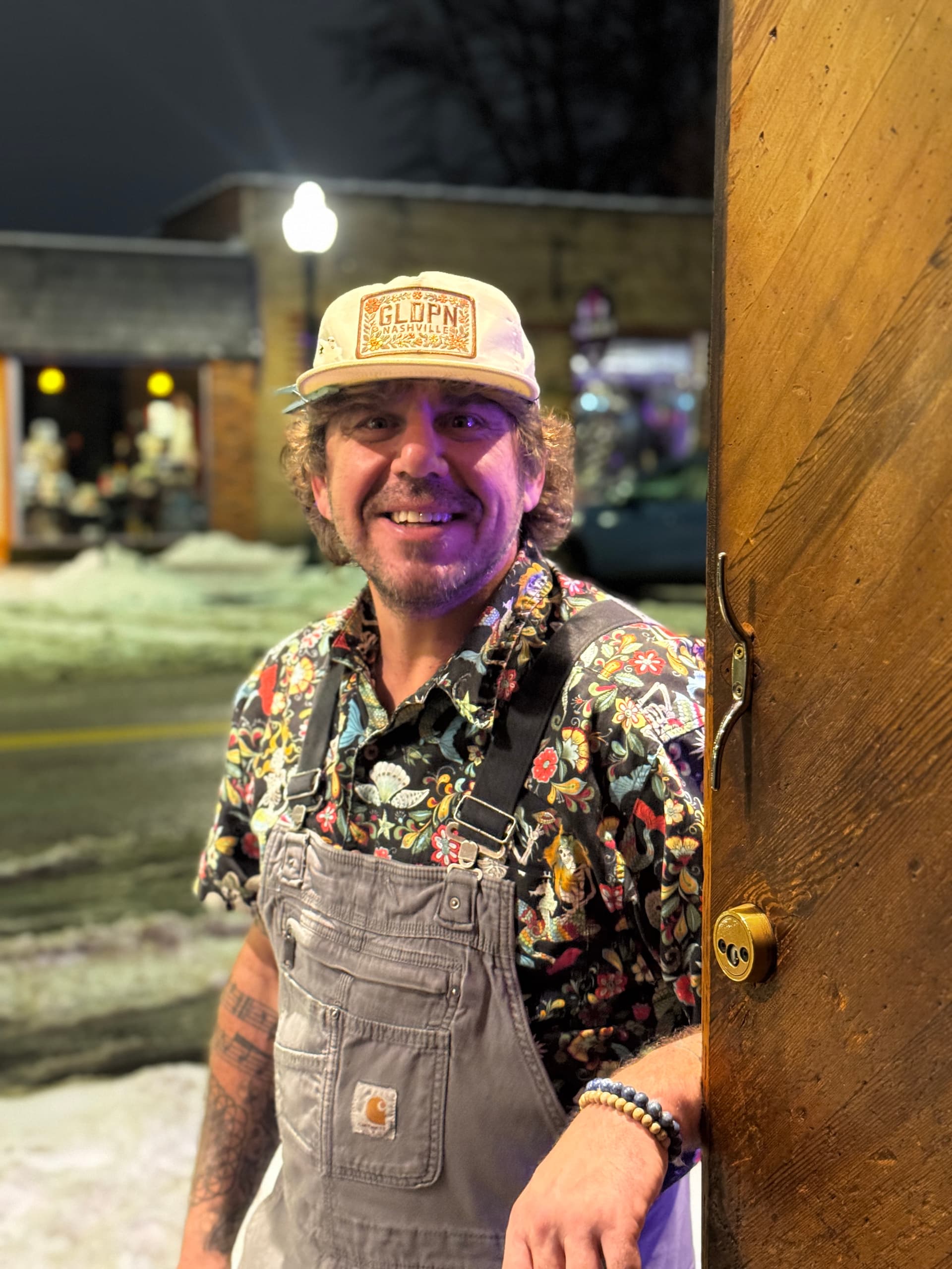 Candid portrait of Ty Stonehawker at a doorway