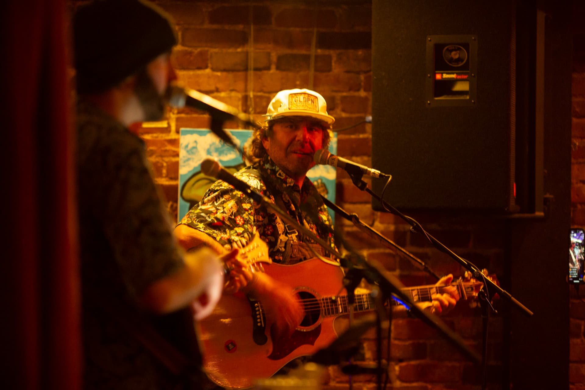 Ty Stonehawker singing and playing guitar live